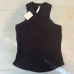Black woman’s Fabletics tank with built-in bra. Size L